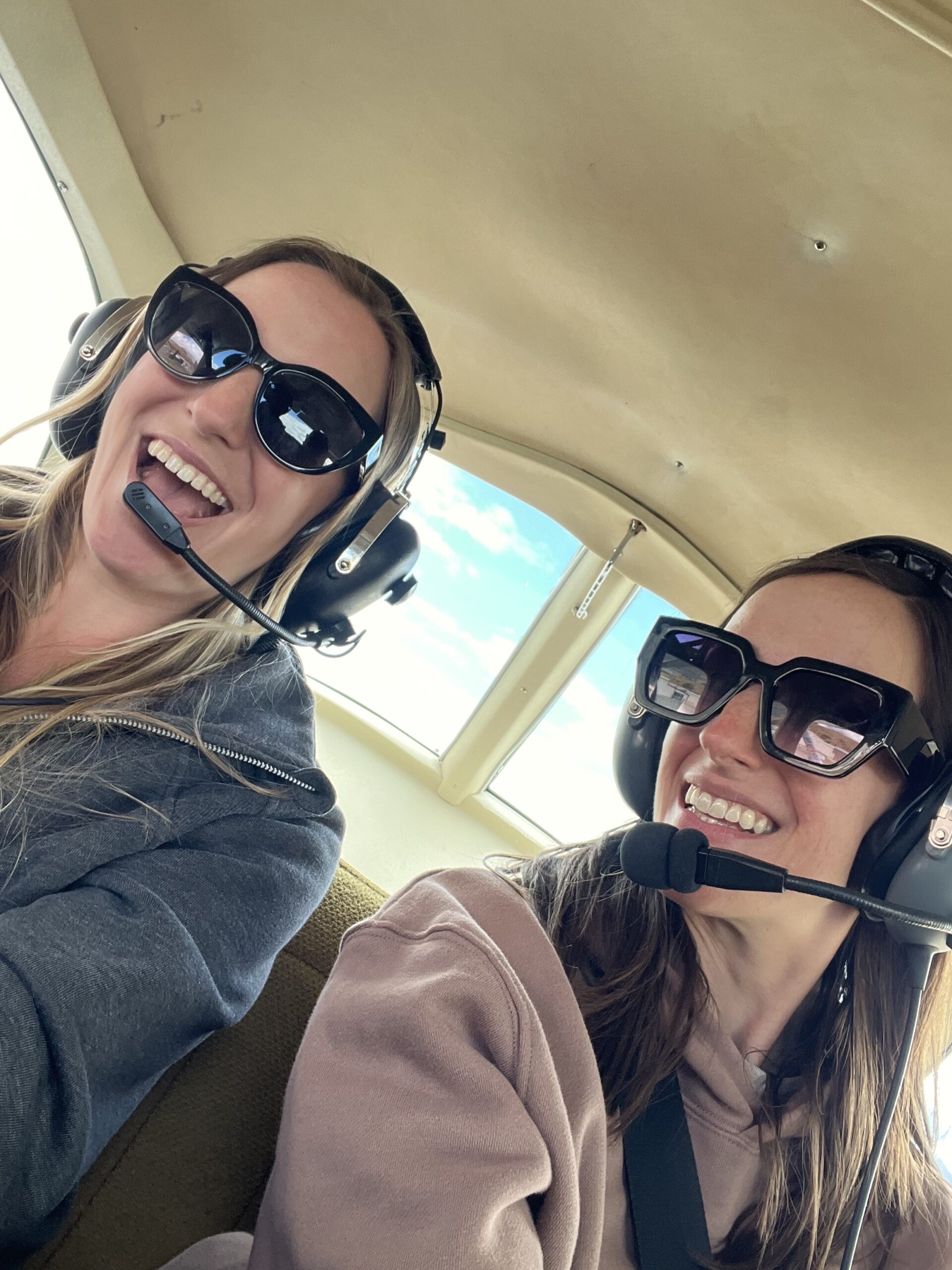 sara and stacy in a small plane